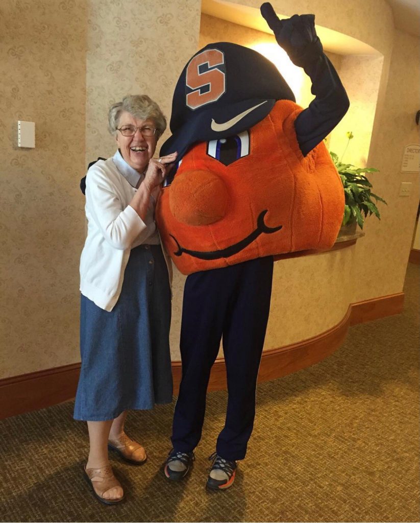 Sister Alma stands with Otto the Orange, who, unbeknownst to her, is her grand-nephew, Michael Lehr.