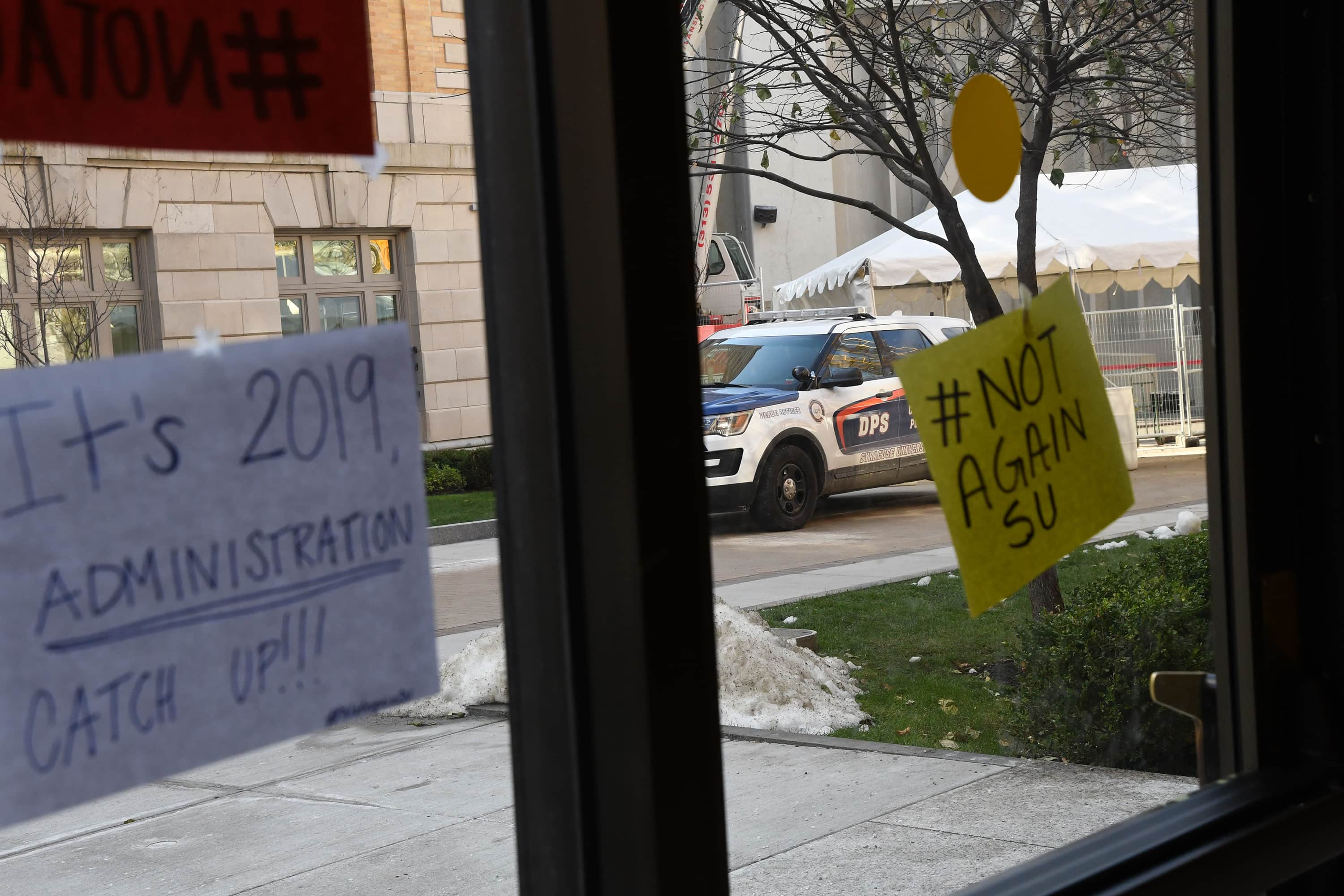 A Department of Public Safety car was parked near Barnes Center where the #NotAgainSU sit-in continued Tuesday.
