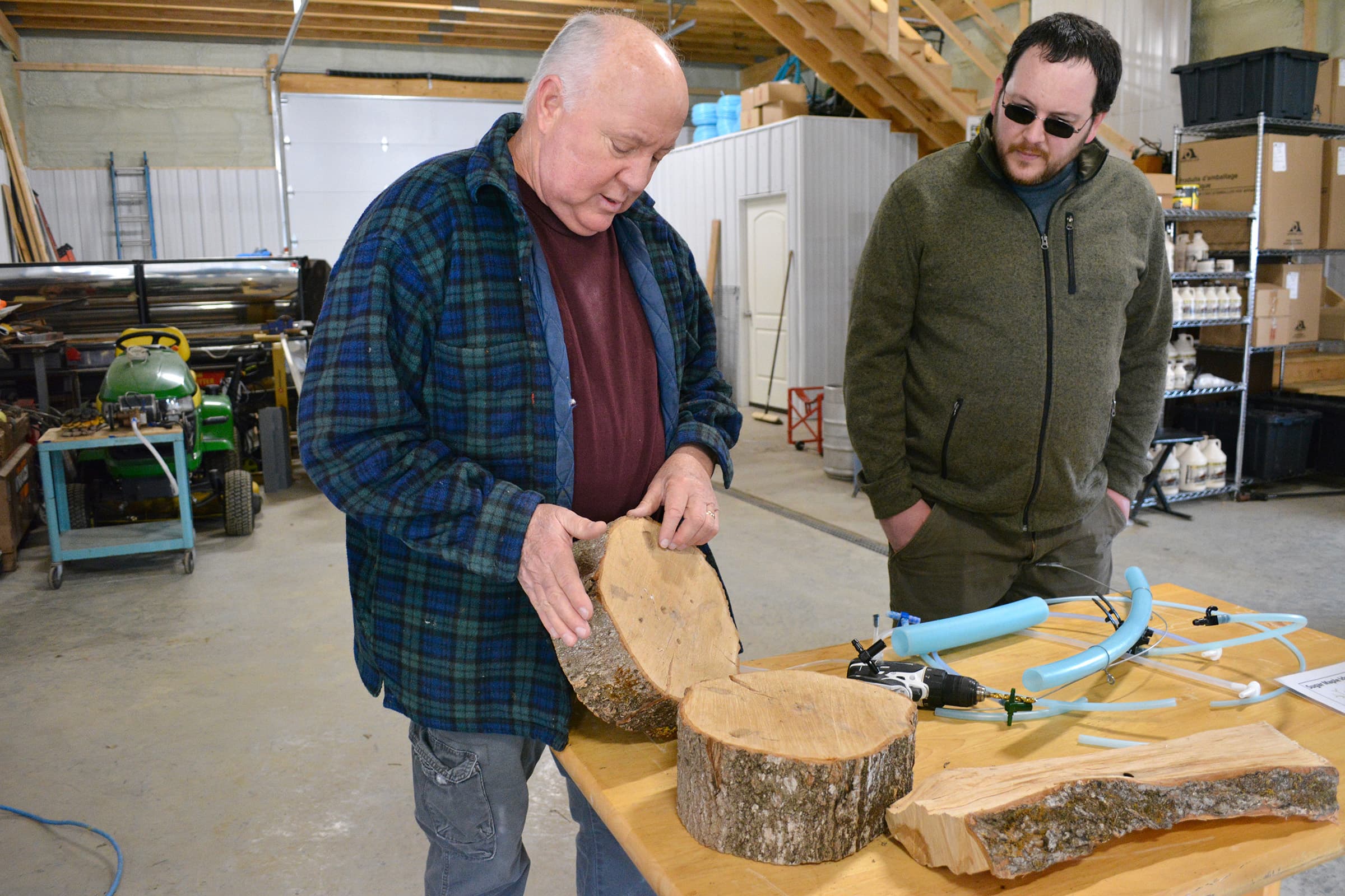 Dan Beasley shows Maple Weekend visitors how a maple tree responds to being tapped.