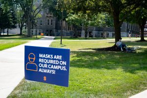 On August 24, 2020, the first day of classes at Syracuse University, a sign reminds students to wear their masks at all times.