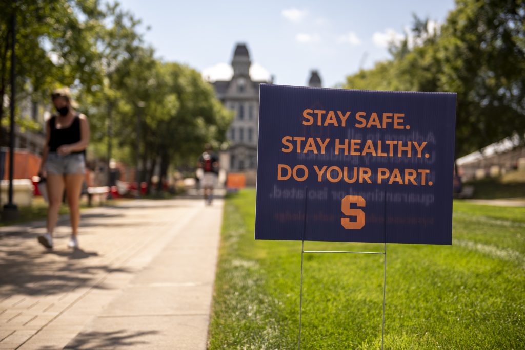 Sign touting the COVID-19 safety pledge on SU's campus on Monday, Aug. 24