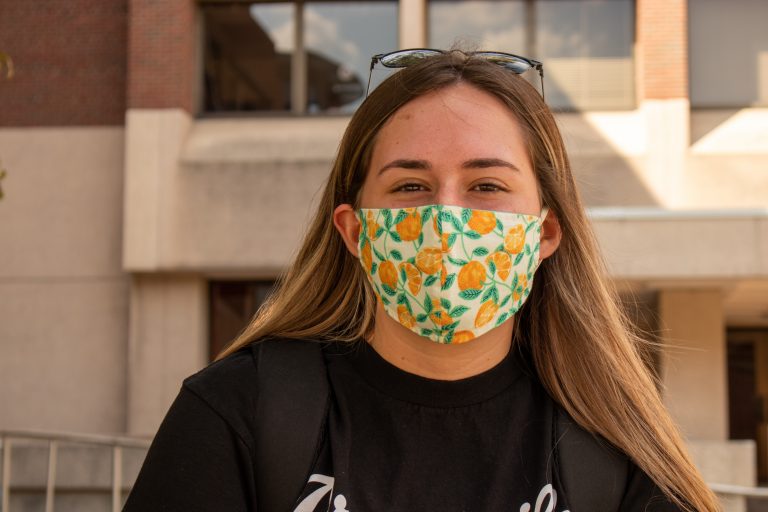 Nutrition Science grad student Melissa Navarro shows some Orange pride by wearing a mask adorned with oranges. "I bought the mask from my friend's Etsy shop and as soon as I saw the one with oranges and I couldn't resist."