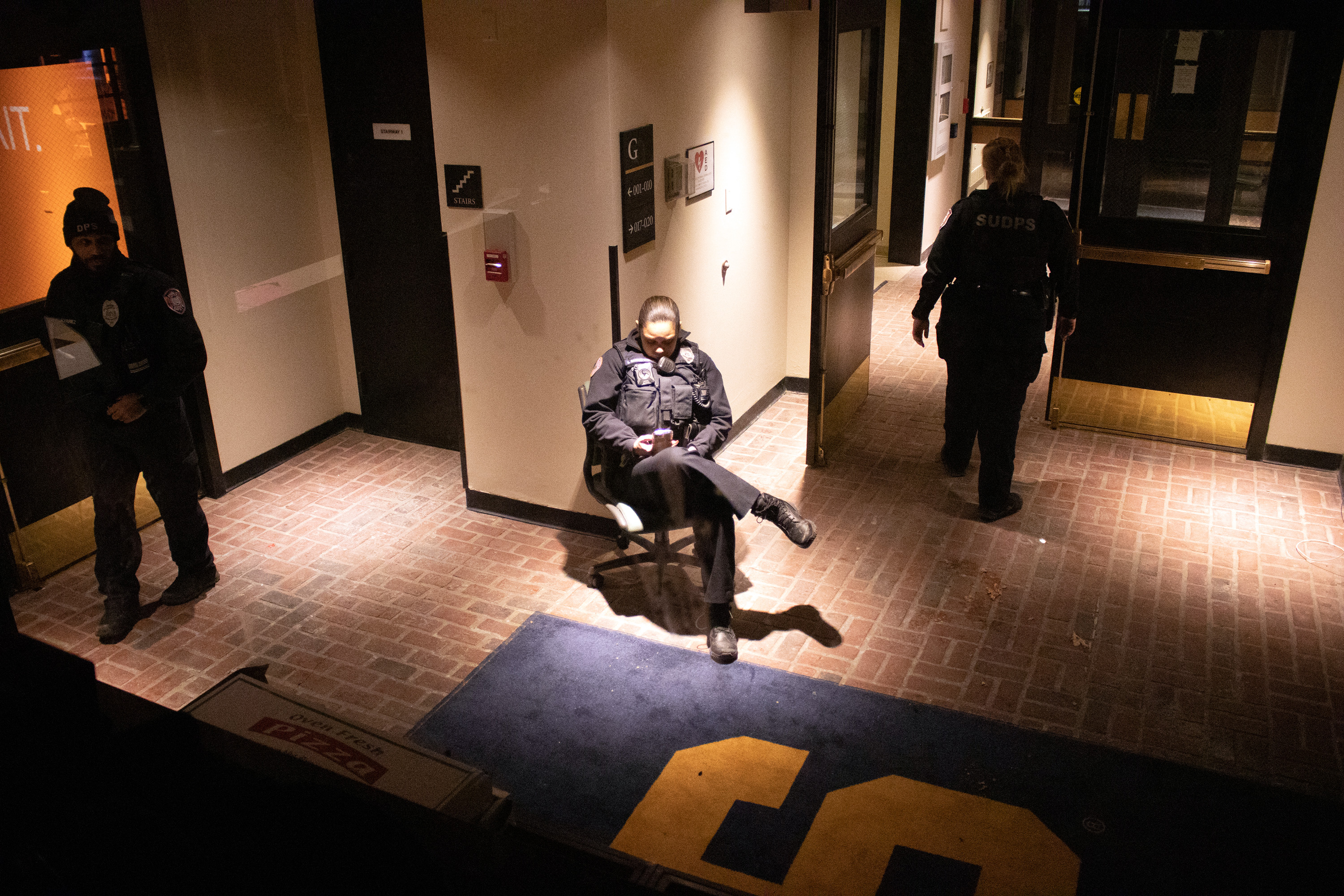 DPS officers guard one of the entrances to Crouse-Hinds Hall on the night of February 18, 2020.