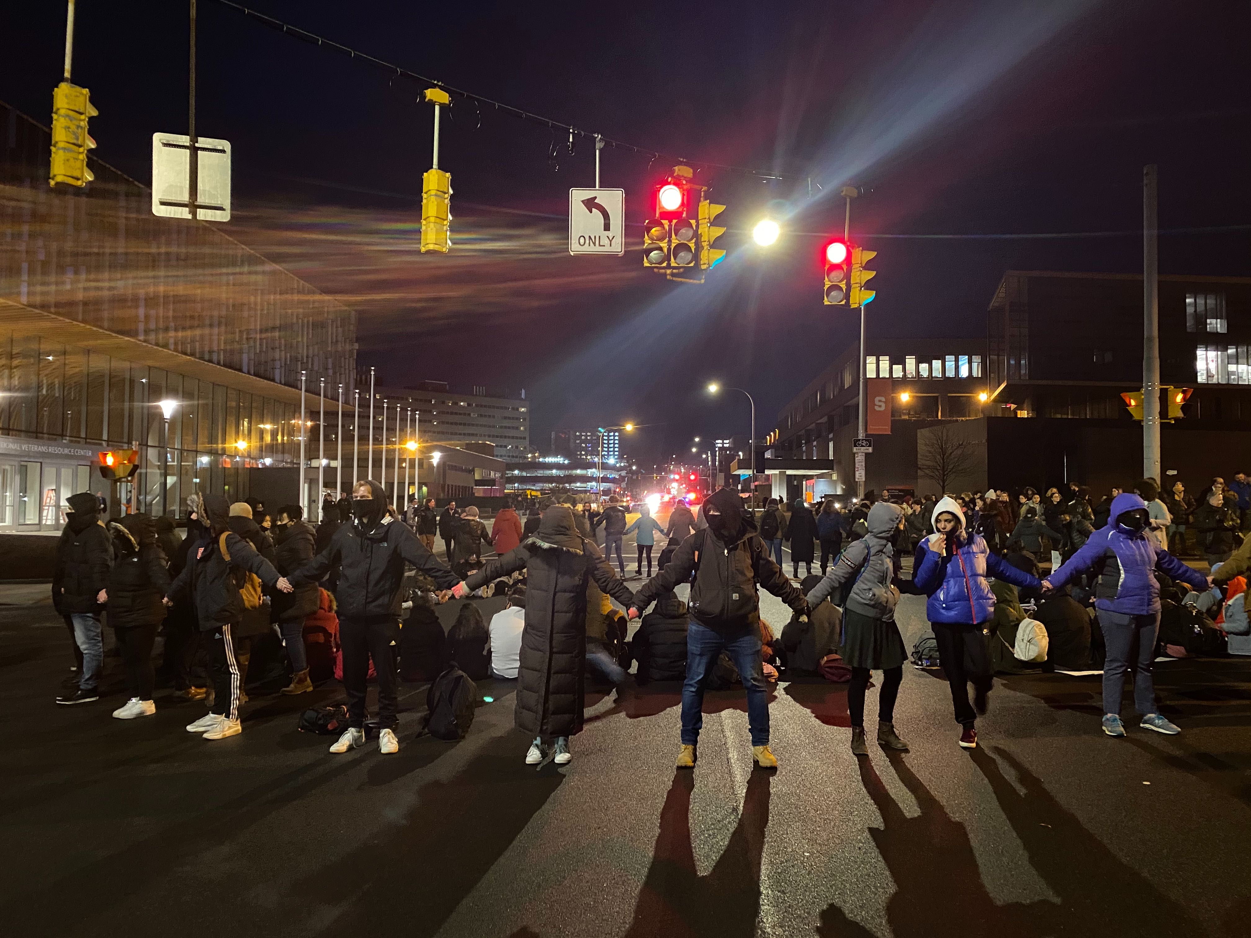 About 100 protestors blocked traffic along Waverly Ave. Wednesday night in an effort to call for negotiations with SU admins.
