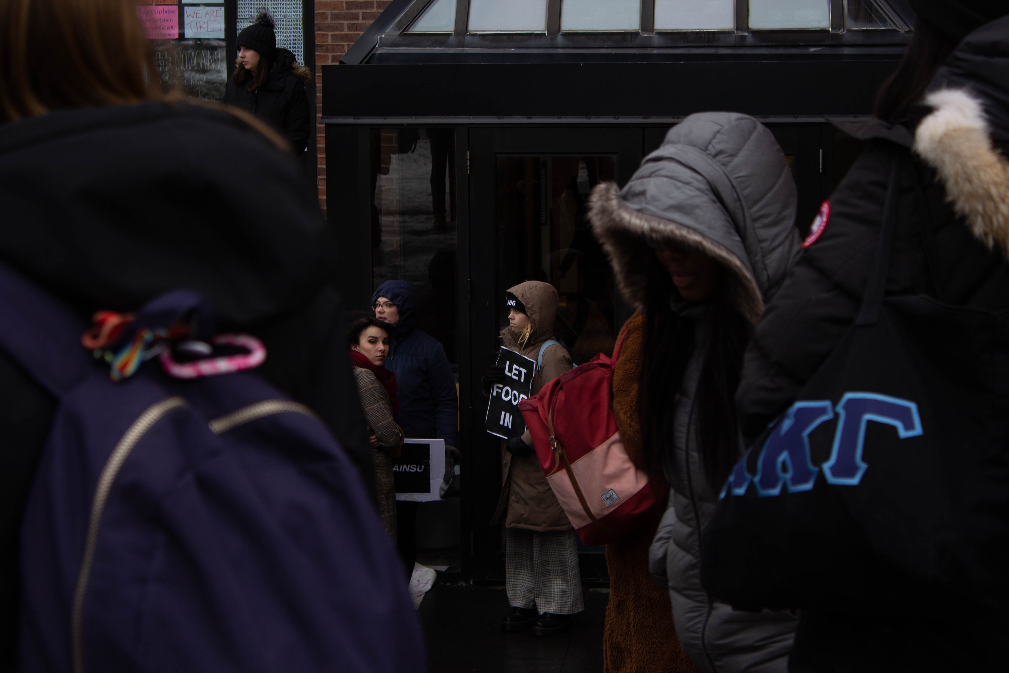 Syracuse students gather in solidarity outside of Crouse-Hinds Hall in response to the the protestors' suspension on Tuesday, February 18, 2020. #NotAgainSU protestors began occupying Crouse-Hinds Hall in response to the administration's failure to address and denounce hate-crimes apparent on Syracuse University's campus.