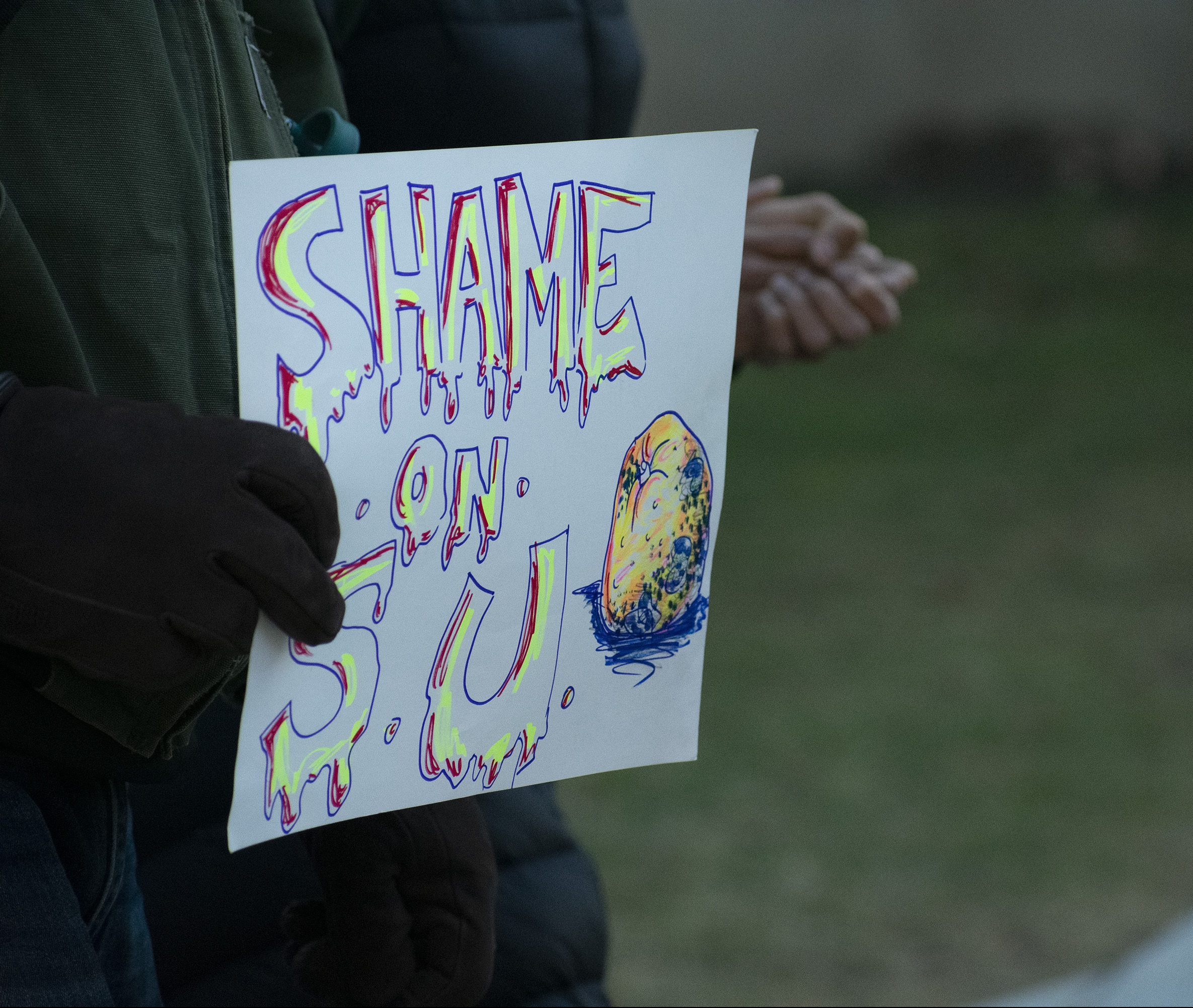 Syracuse University faculty members and students marched across campus to show solidarity with #NotAgainSU protestors on March 5, 2020.