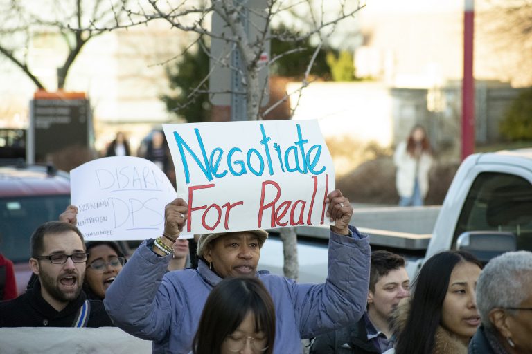 Syracuse University faculty members and students marched across campus to show solidarity with #NotAgainSU protestors on March 5, 2020.