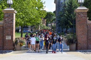 SU Student Association president Justine Hastings leads a group of students on a solidarity march through campus on Friday.