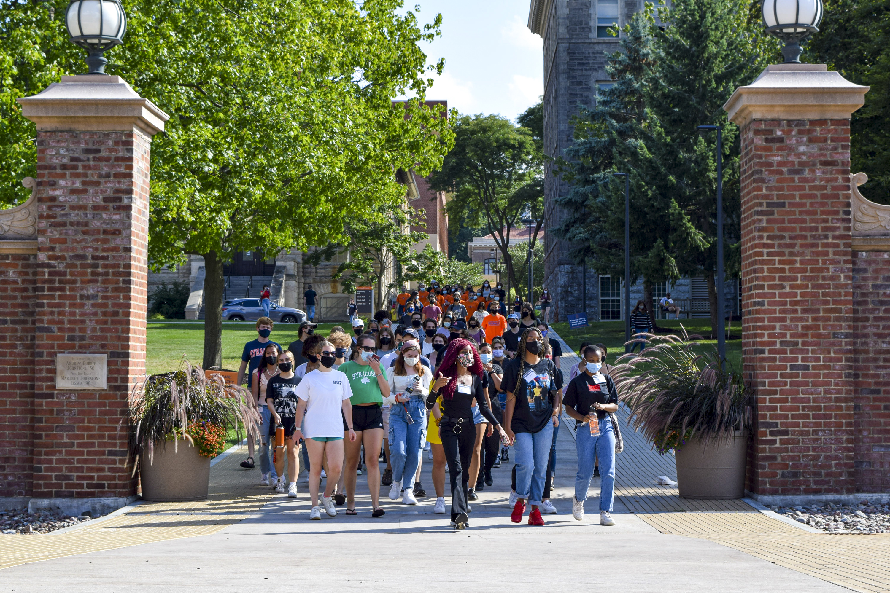 SU Student Association president Justine Hastings leads a group of students on a solidarity march through campus on Friday.