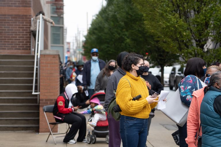 Voters waited in line with their mail-in ballot applications outside of Temple University's Liacouras Center in Philadelphia, Penn., on October 26, 2020