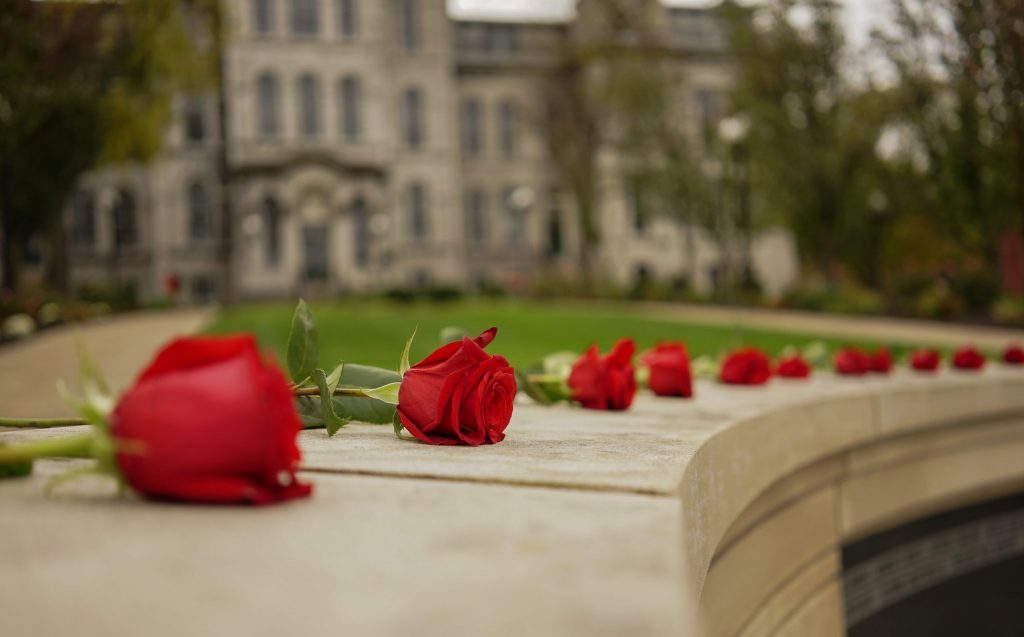 Roses left for the Remembrance Week ceremony on Friday, Oct. 22, 2021