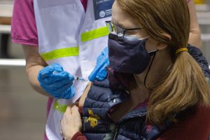 A nurse injects a patient with a dose of the COVID-19 vaccine on Friday, February 26th. The Oncenter is currently home to the vaccine clinic as well as a testing center.