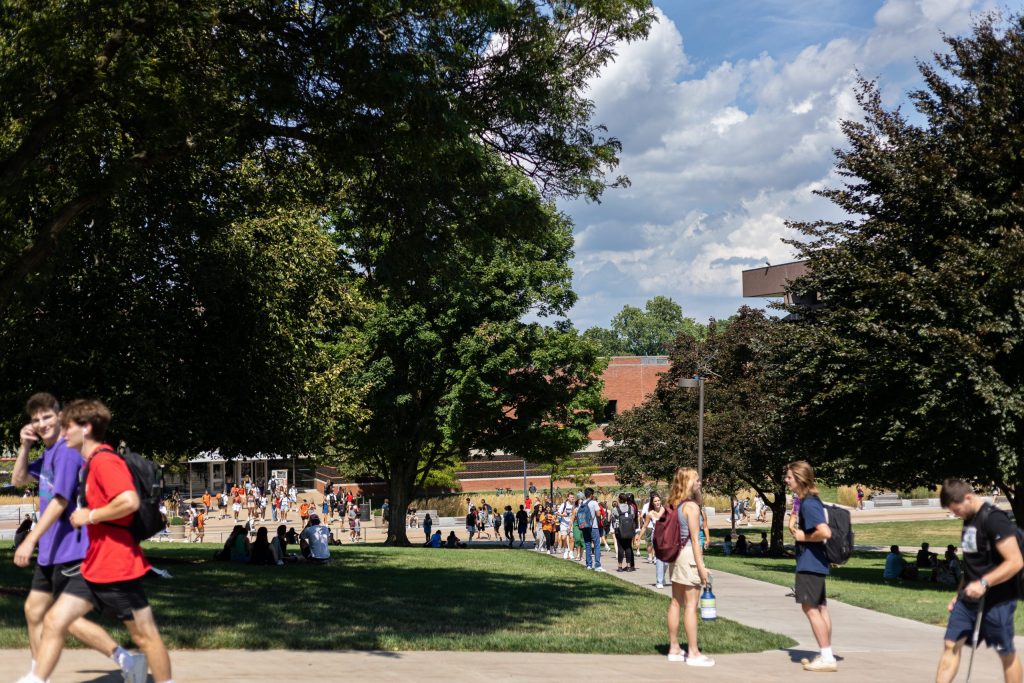 Students walk up from Schine towards the campus quad on the first day of school.