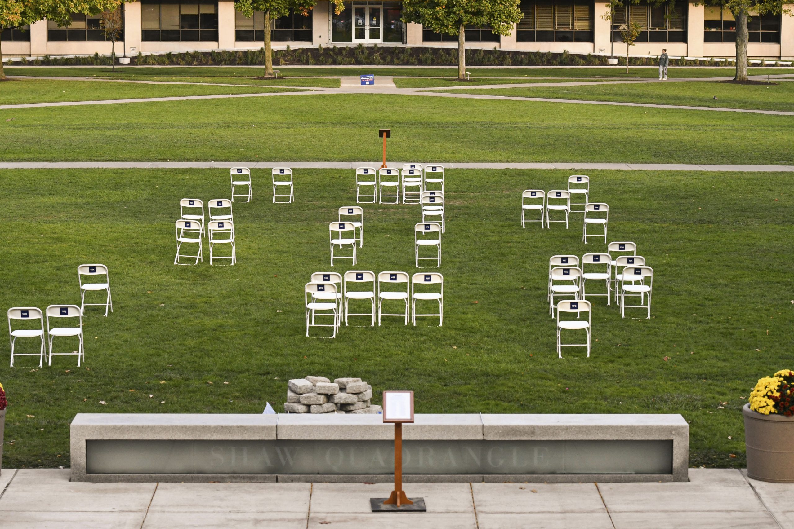 Thiry-five chairs, representing the 35 Syracuse students who lost their life in the bombing of Pan Am Flight 103, are lined up in the Quad corresponding to where each student sat on the plane. (Photo by Cole Bambini | The Newshouse)