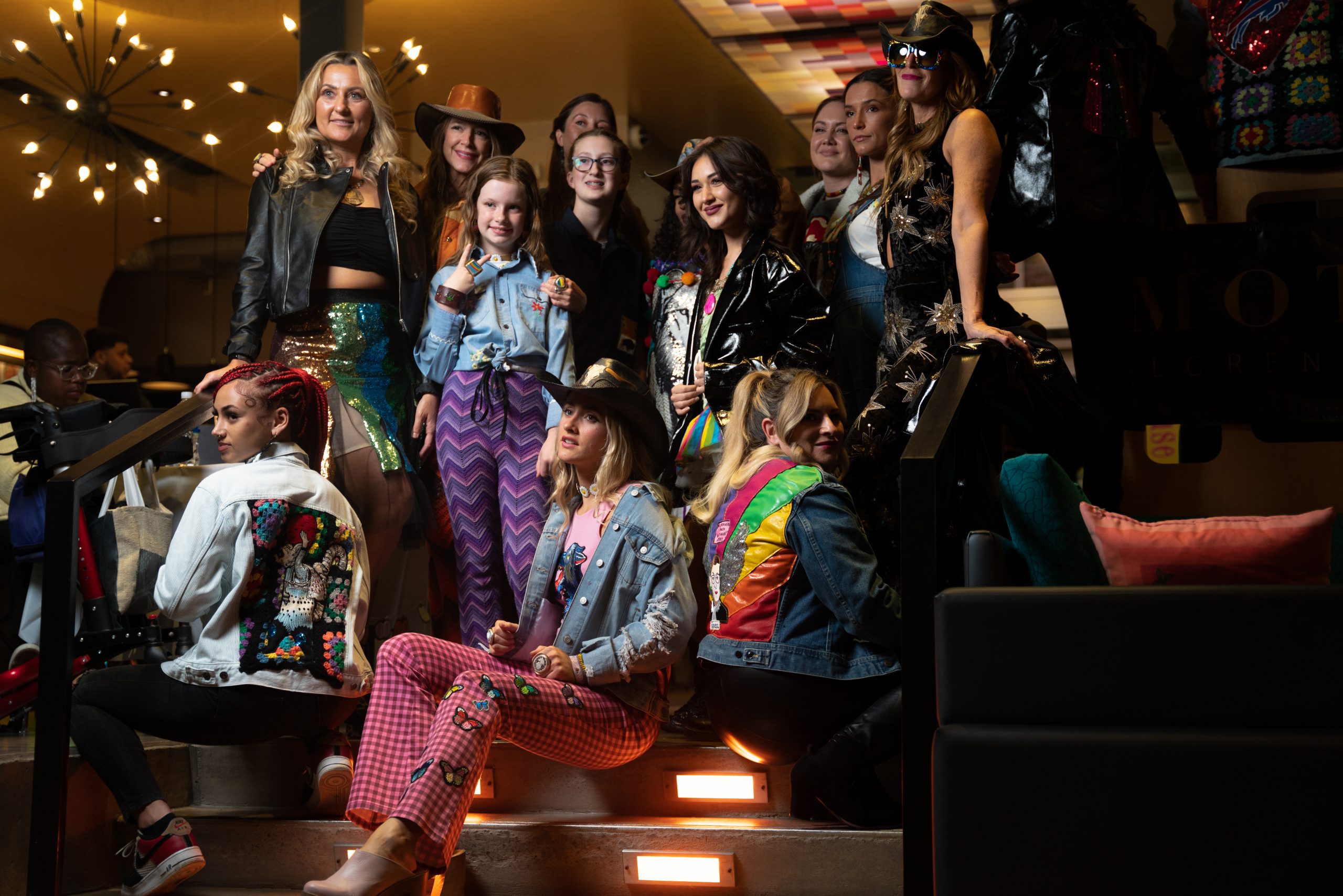 Group photo of models and designers in Aloft hotel lobby, taken after Syracuse Fashion Week's Wednesday 