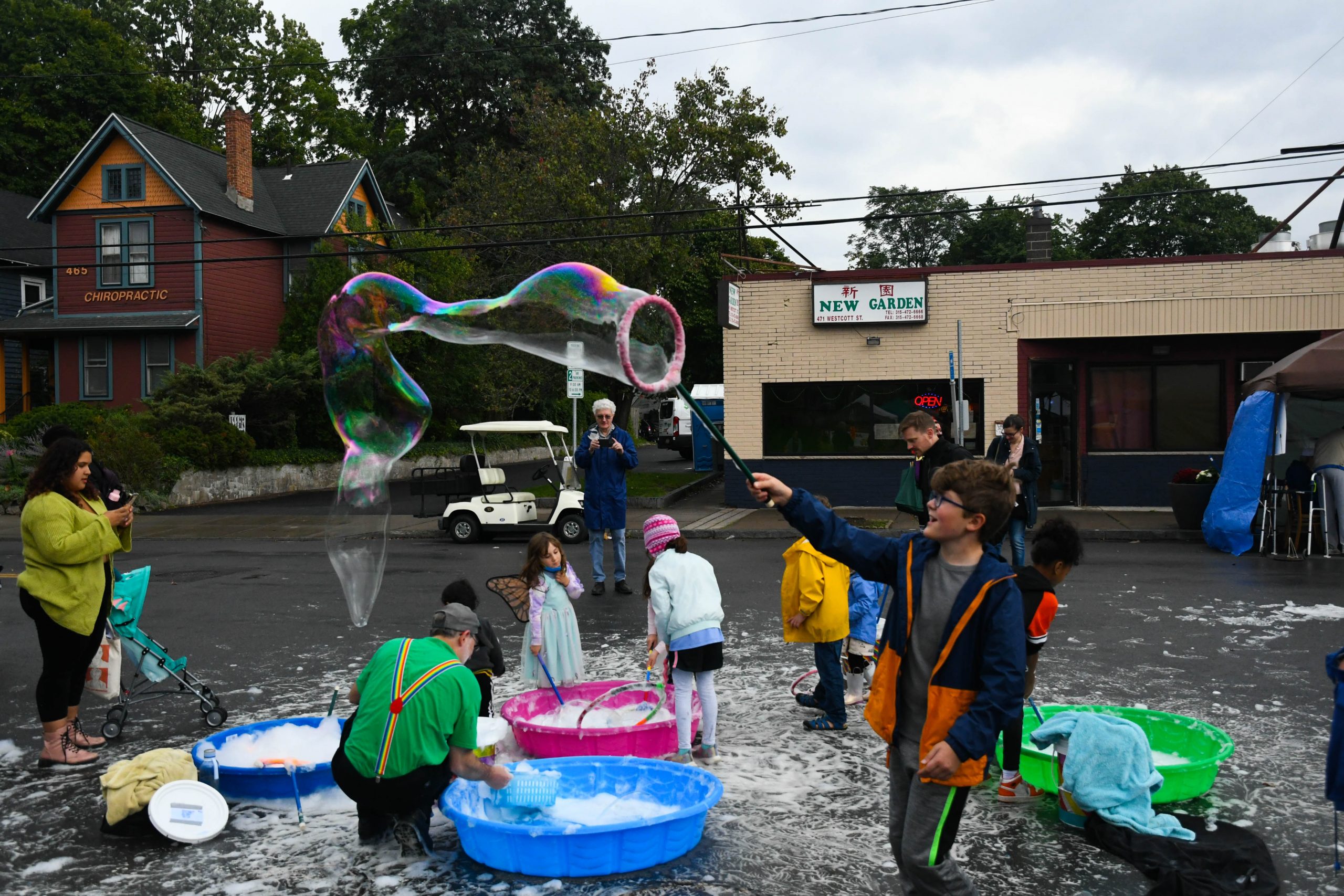 Children playing with bubbles at the Westcott Street Cultural Fair