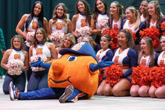 Otto the Orange, joined by a lively group of SU cheerleaders, embodies the spirited energy and excitement of 'Cuse Nation.