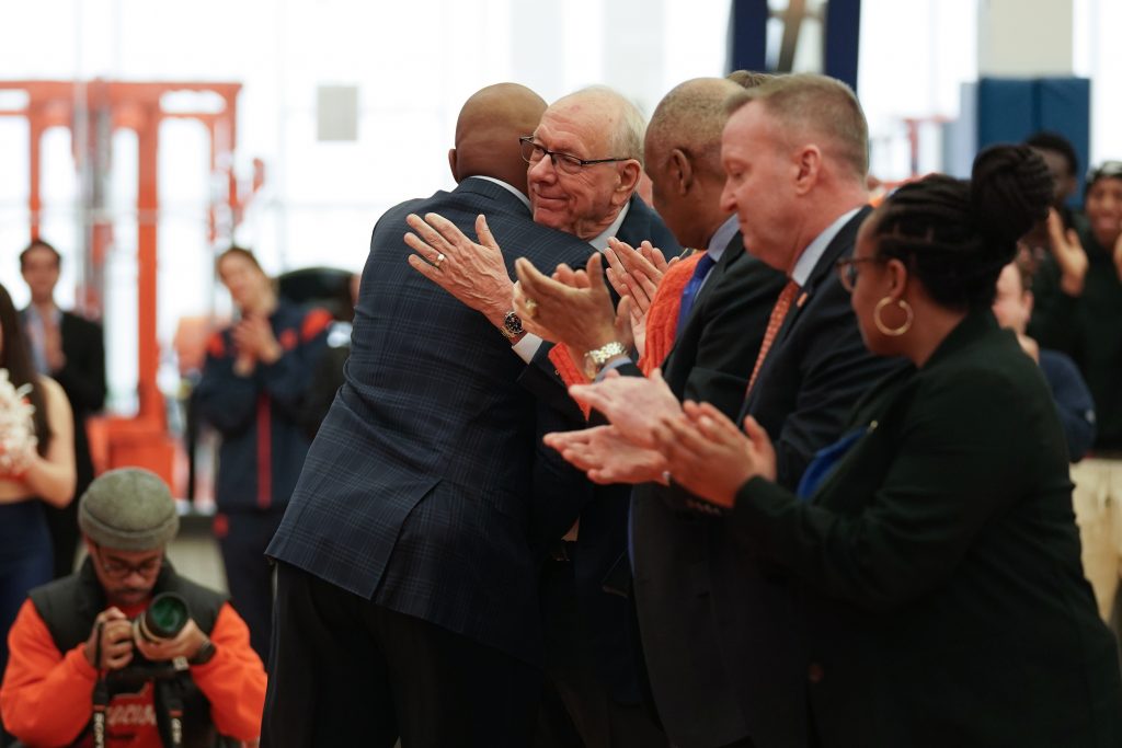 Adrian Autry and Jim Boeheim embrace after a press conference on Friday, March 10, 2023 in the Carmelo K. Anthony Basketball Center. Photo by Joseph Martino.
