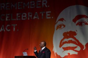 Reverend Phil Turner addresses the crowd at the 38th annual Rev. Dr. Martin Luther King Jr. Celebration at Syracuse University's JMA Wireless Dome on Sunday, Jan. 22, 2023.