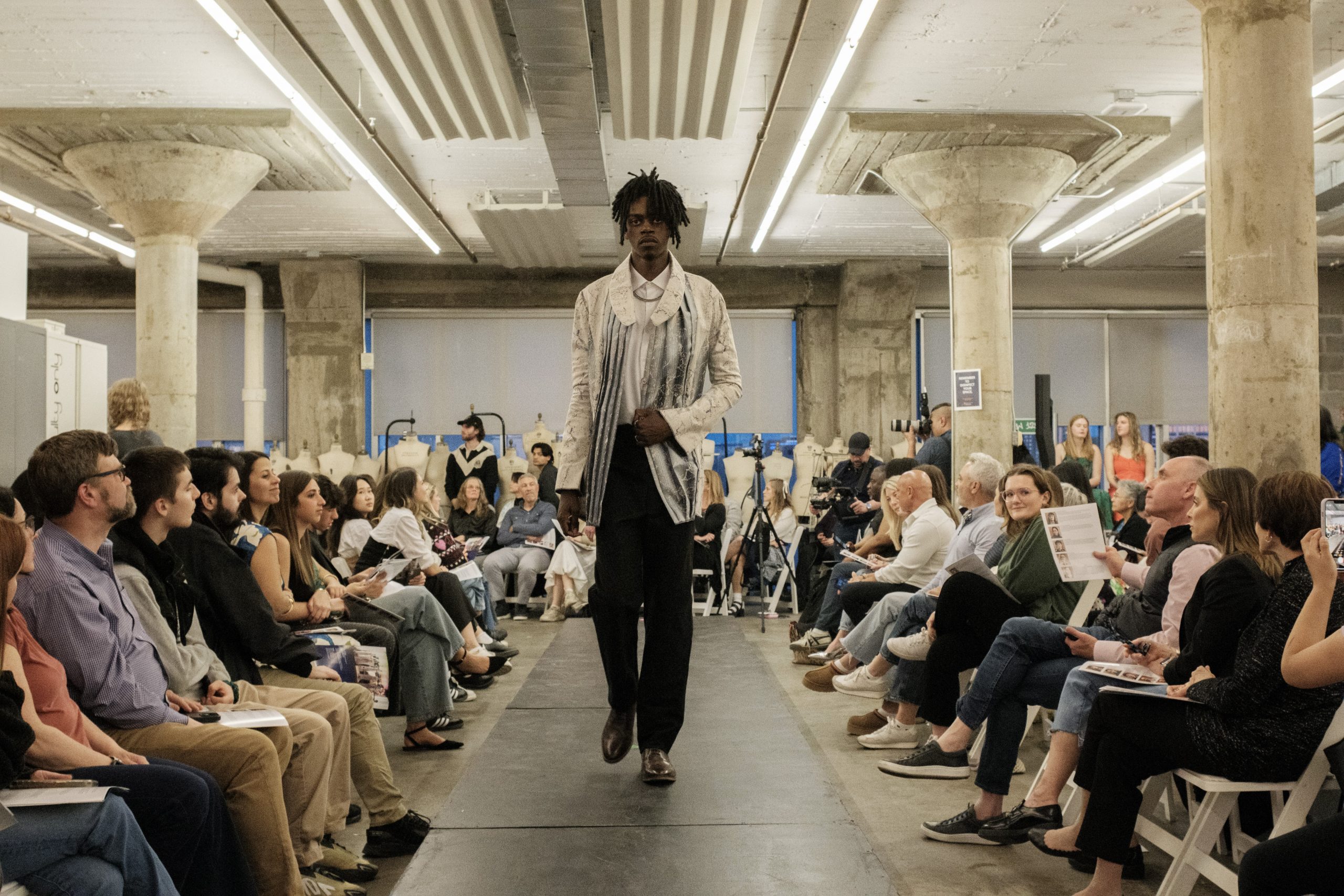 Models wearing senior fashion design students' outfits walk the runway during the VPA Senior Fashion Show on April 25, 2024, at the Nancy Cantor Warehouse.