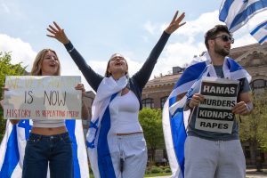 Supporters who participated in an Israeli march across Syracuse University's campus chant on the Shaw Quad on Wednesday, May 1, 2024.