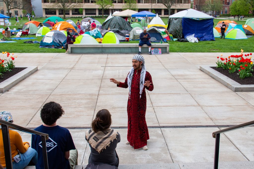 SUNY ESF speaker Mx. Yaffa engages the crowd in community activities during talk in front of the pro-Palestinian encampment on SU's quad on April 30, 2024.