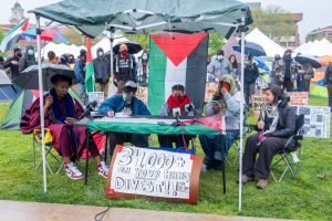 Pro-Palestinian students and faculty hold a press conference in front of the encampment on Shaw Quad at Syracuse university. Pictured left to right: Dr. Jenn Jackson, Cai Cafiero, Miko, Rosalia, Dr. Carol Fadda.