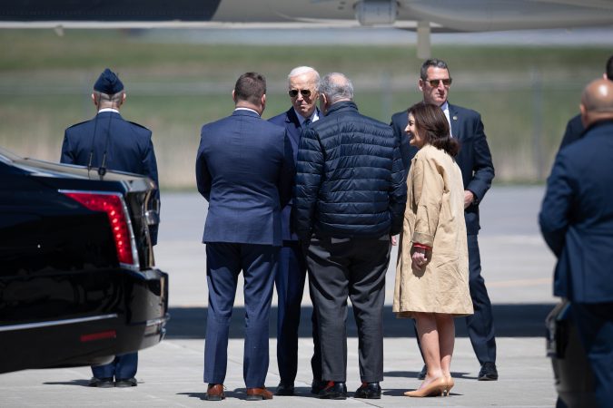 President Joe Biden chats with NY Governor Kathy Hochul and House Majority Leader Chuck Schumer after exiting Air Force One at Syracuse International Airport on April 25, 2024. Biden is in Syracuse to celebrate his CHIPS program that led to Micron building a multi-billion dollar semiconductor facility in Clay, NY.