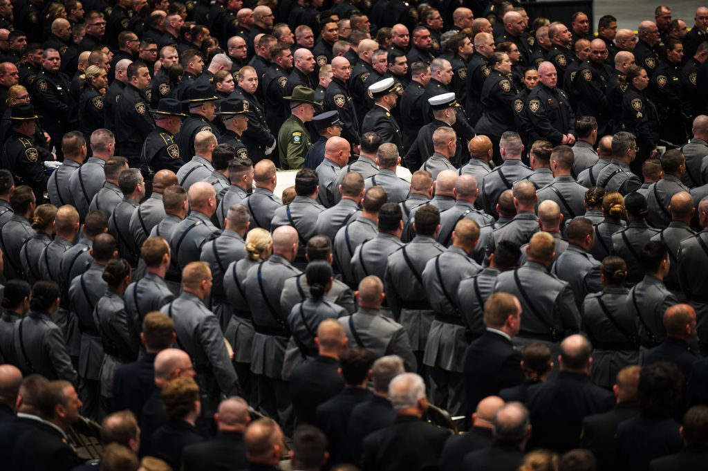 First responder body bearers carry the remains of Sheriff Michael A Hoosock at the New York State Fairgrounds Exposition Center, April 22, 2024. Hoosock was killed on duty on April 14, 2024.