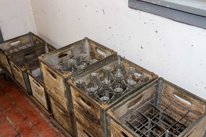 At Hoover's Dairy, customers drop their used glass bottles in the crate before buying fresh bottles of milk.