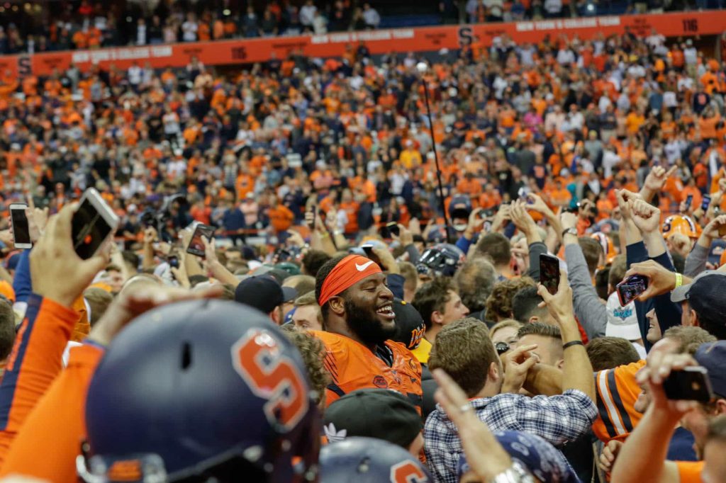 Syracuse fans storm the Carrier Dome field after SU upset Clemson 27-24 in 2017.