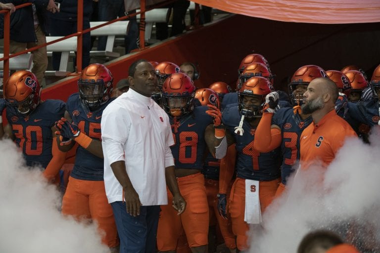 Dino Babers stands with his Syracuse football team prior to the Louisville game in the Carrier Dome on Nov. 10, 2018.