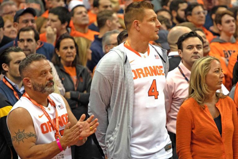Rob Gronkowski, then a player with the New England Patriots, attended the SU-Duke basketball game on Feb. 23, 2019 as a guest of Syracuse businessman Adam Weistman (left).