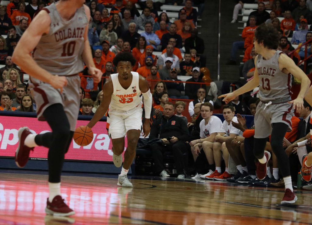Elijah Hughes brings up the ball against Colgate on Nov. 13, 2019, in the Carrier Dome.