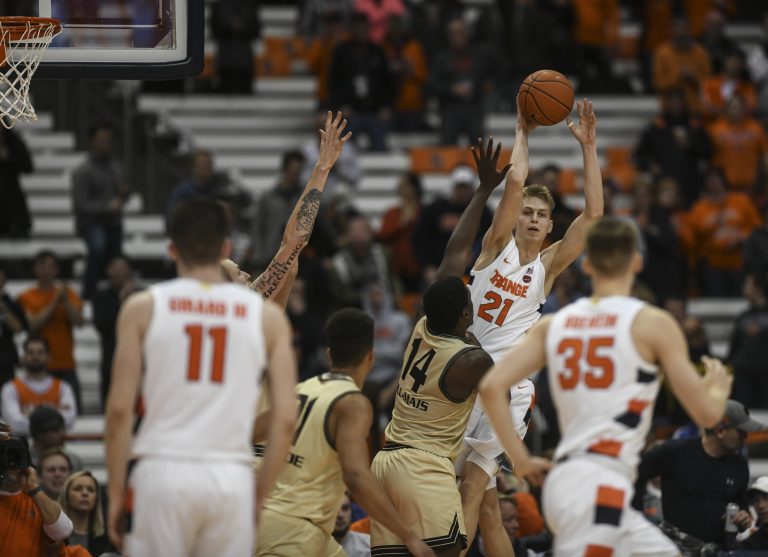 Syracuse Basketball vs. Oakland - Marek Dolezaj passes the ball back to Buddy Boeheim