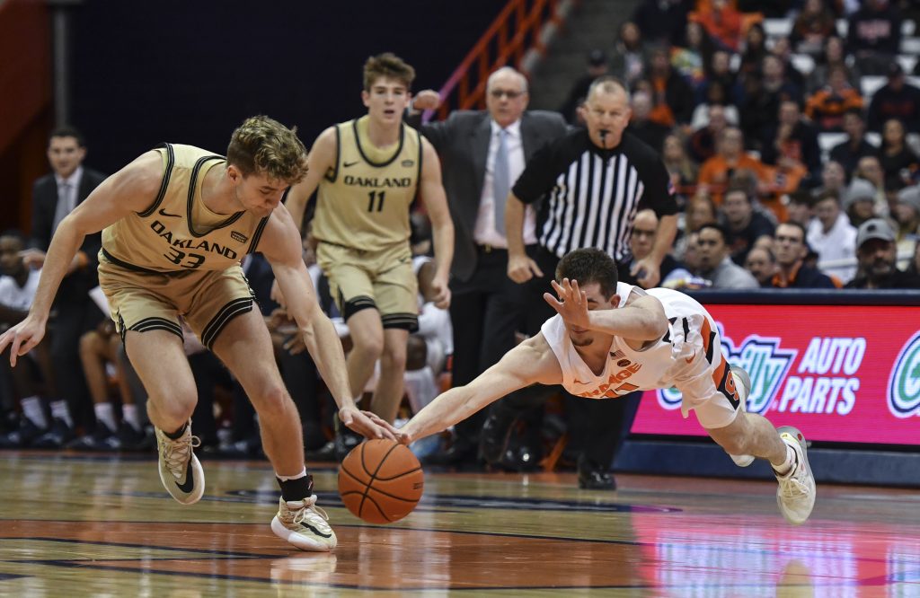 Syracuse Basketball vs. Oakland - oe Girard III dives for the ball