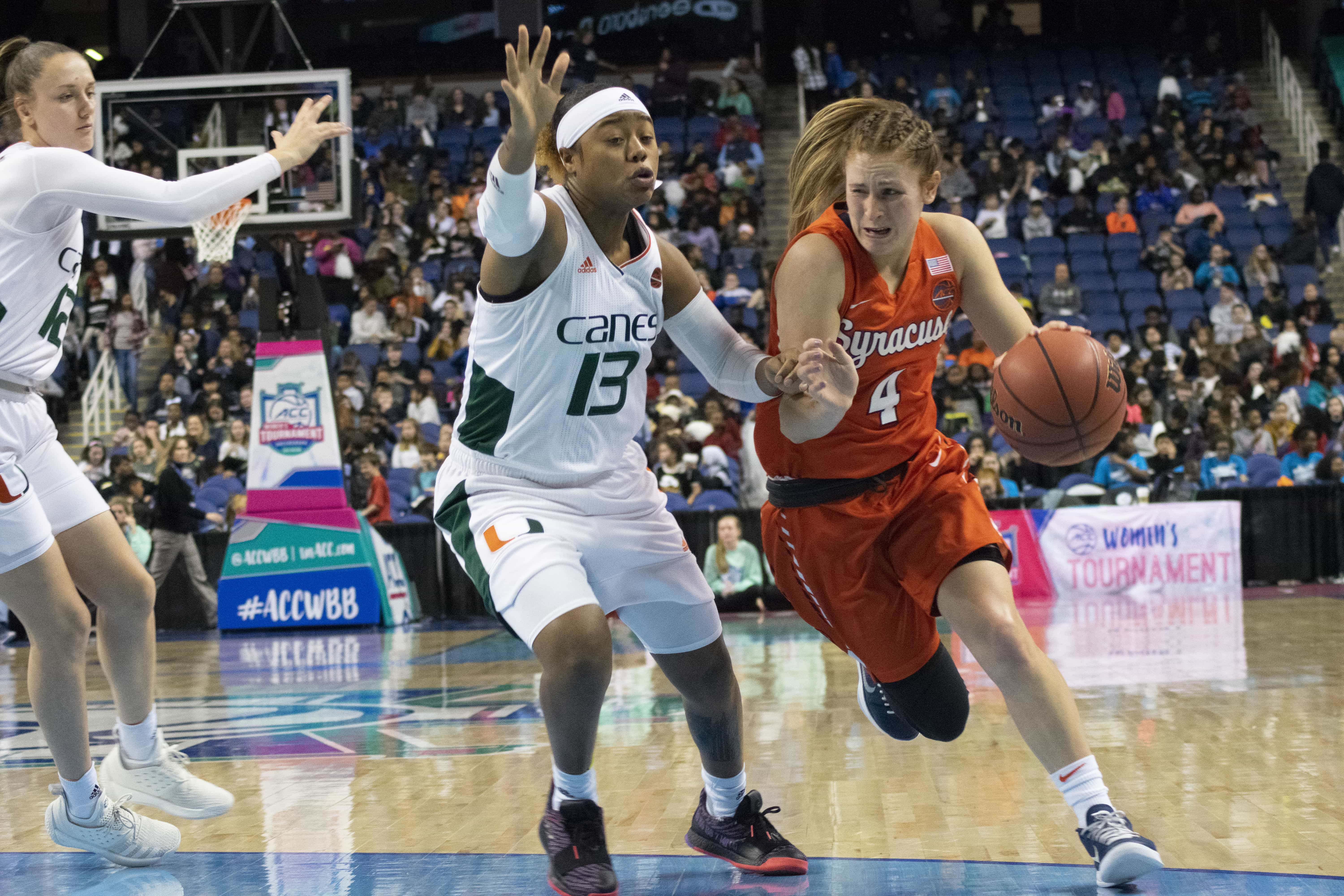 Tiana Mangakahia drives to the basket while being defended by Miami’s Taylor Mason.