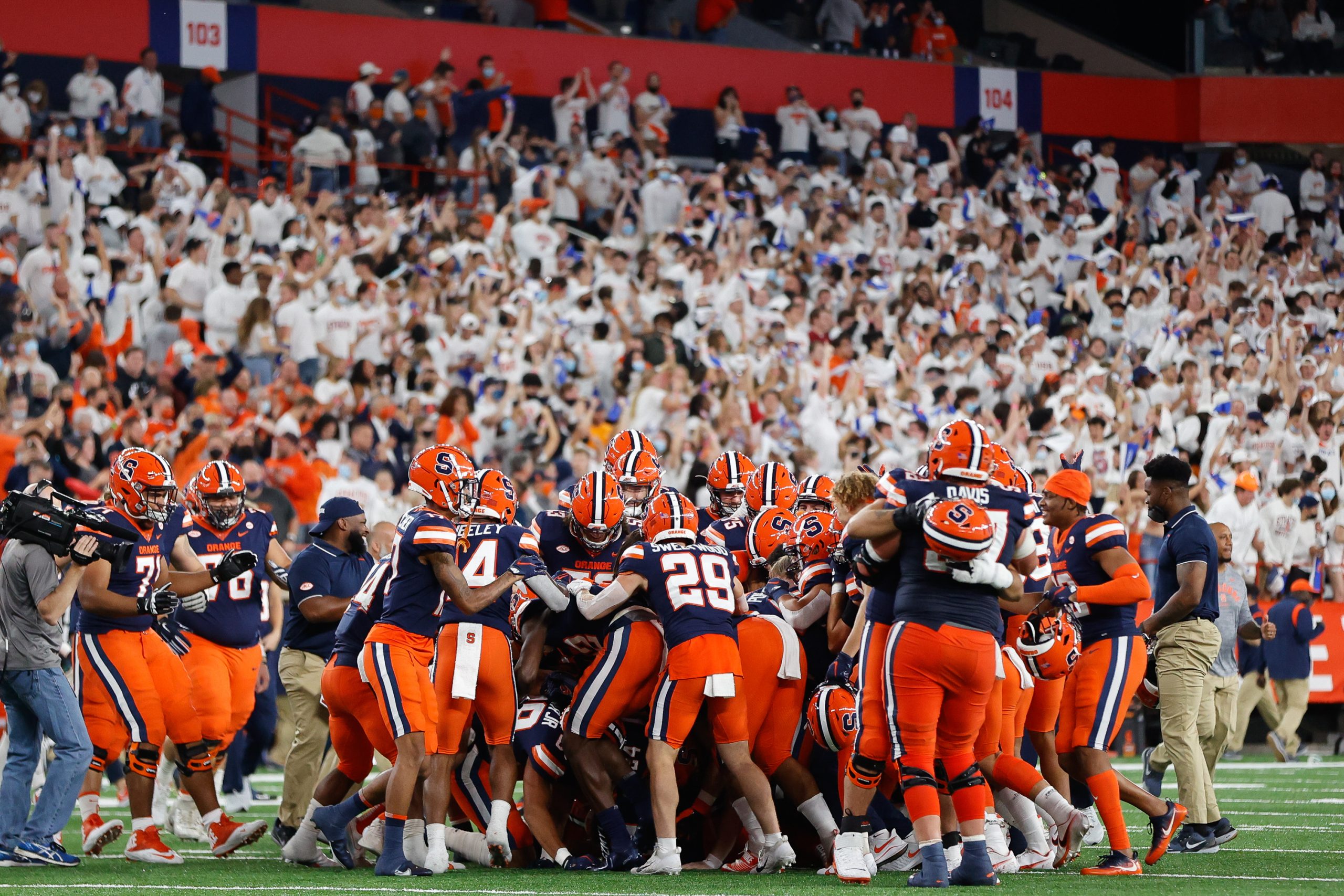 Syracuse Football team celebrates after kicker Andrew Szmyt scores a field goal for a walkoff win against Liberty University at the Carrier Dome in Syracuse, NY on September 24, 2021. The Orange come away with the win, 27-24 Friday night.