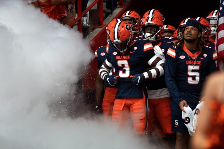 ed by Taj Harris (3), the Syracuse football team awaits in the tunnel to hit the field before an NCAA football game against Rutgers, Saturday, at the Carrier Dome.
