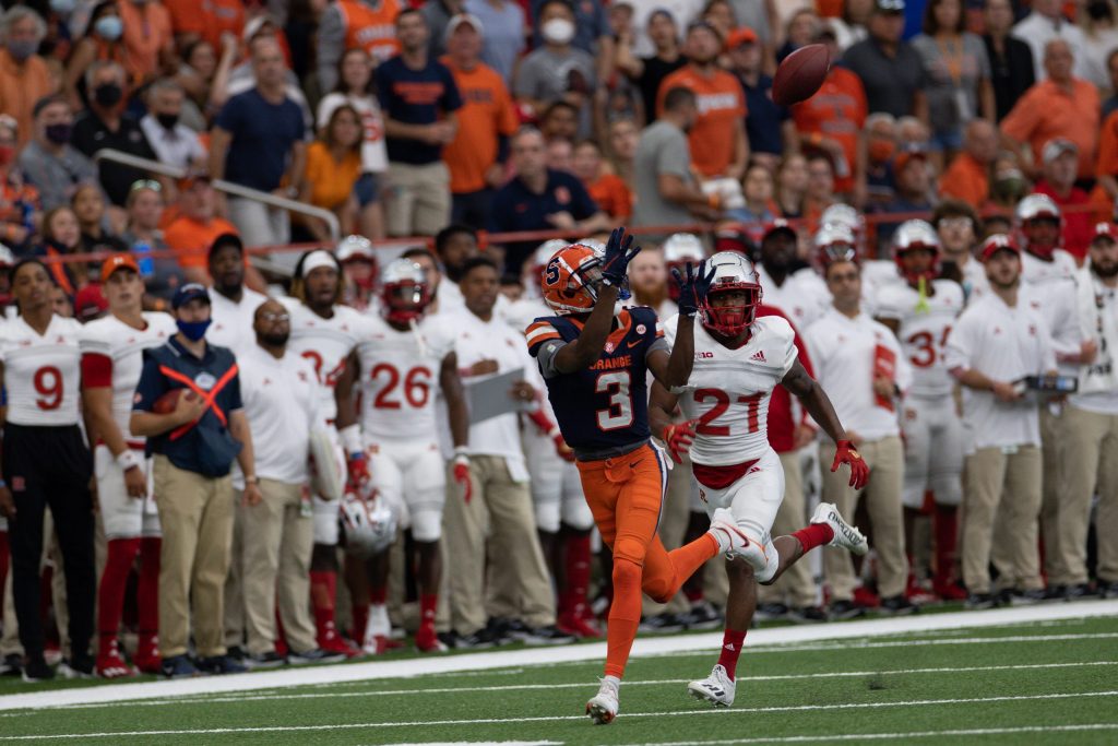 Syracuse’s Taj Harris (3) eyes a deep pass that he caught in front Rutgers’ Tre Avery during an NCAA football game, Saturday, at the Carrier Dome.