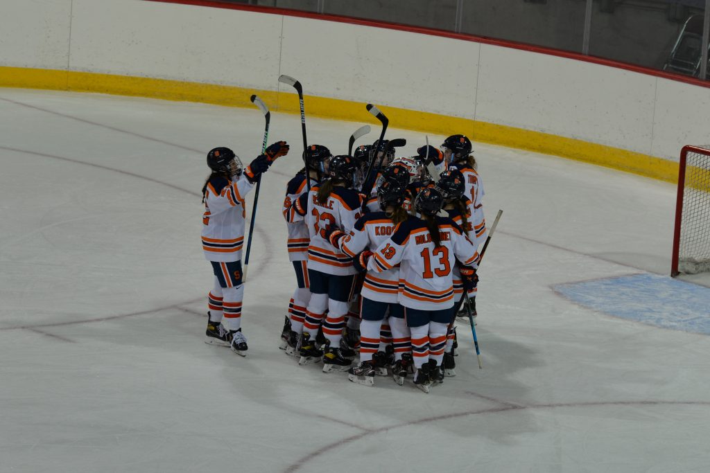 Syracuse women's ice hockey celebrates after beating Lindenwood 6-0 in the first round of the 2021 CHA Tournament.