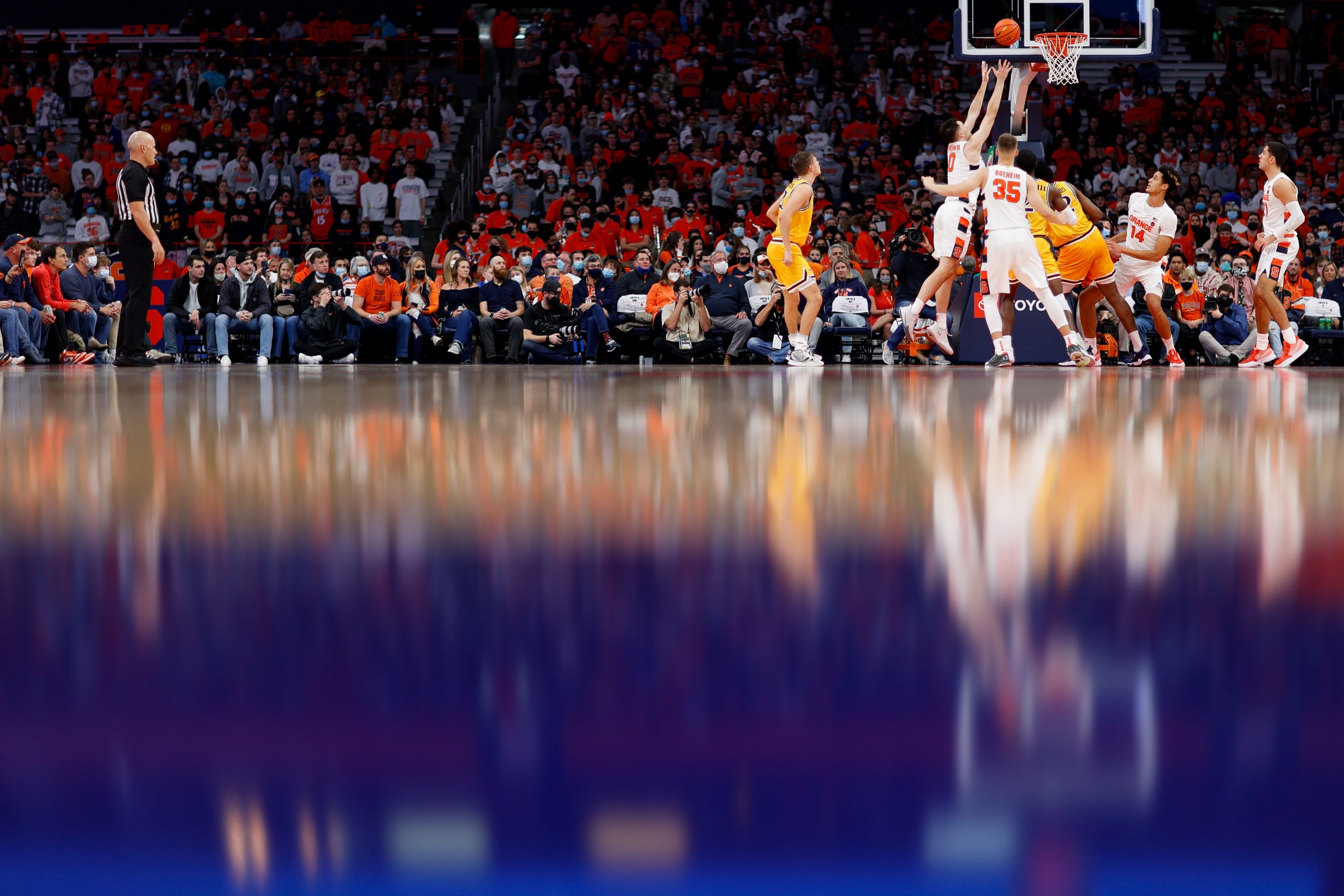 Syracuse forward Jimmy Boeheim rises for a rebound through the glossy floor at The Dome in Syracuse's win over Drexel on Sunday night.