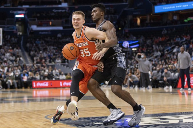 Syracuse's Buddy Boeheim (35) drives to the basket against Georgetown's Aminu Mohammad during an ACC men's basketball game on Saturday at Capital One Arena.