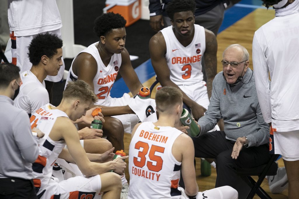 Syracuse coach Jim Boeheim talks with his players during a time-out in the first half against N.C. State on Wednesday, March 10, 2021 during the ACC Tournament at the Greensboro Coliseum in Greensboro, N.C.
