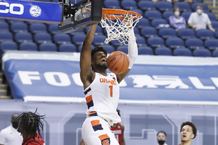 Syracuse's Quincy Guerrier (1) slams in two during the first half of N.C. State’s game against Syracuse in the second round of the ACC Men’s Basketball Tournament in Greensboro, N.C., Wednesday, March 10, 2021.