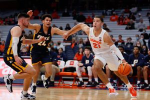 Syracuse's Cole Swider makes a drive for the paint during a Men's Basketball exhibition game against Pace University on October 27, 2021.