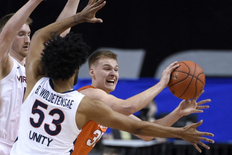 Syracuse guard Buddy Boeheim (35) is pressured by Virginia during the 2021 New York Life ACC Men's Basketball Tournament in Greensboro, N.C., Thursday, March 11, 2021.