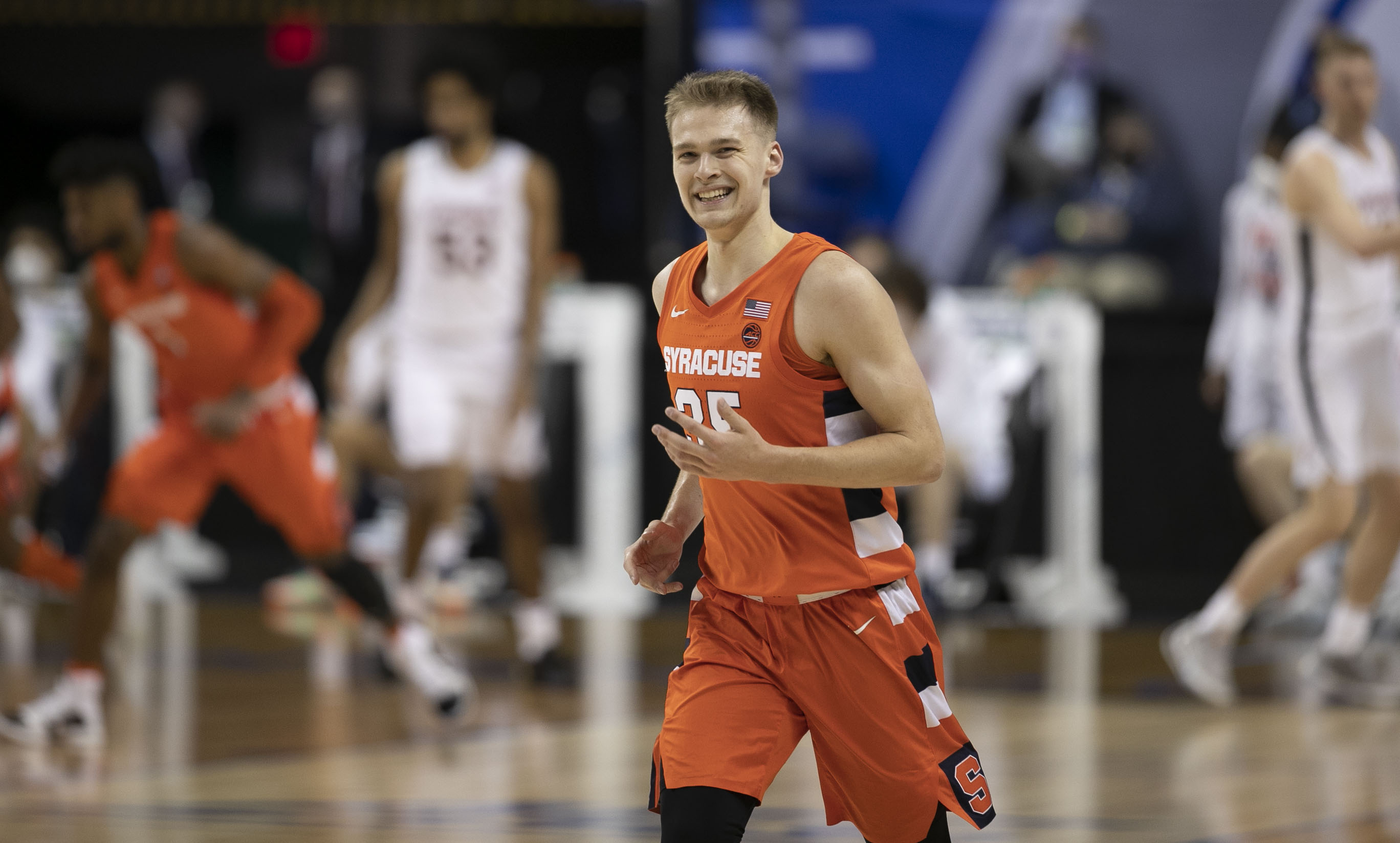 Syracuse’s Buddy Boeheim (35) flashes a smile after sinking a three-point basket to give Syracuse an early lead over Virginia on Thursday, March 11, 2021 during the ACC Tournament at the Greensboro Coliseum in Greensboro, N.C.