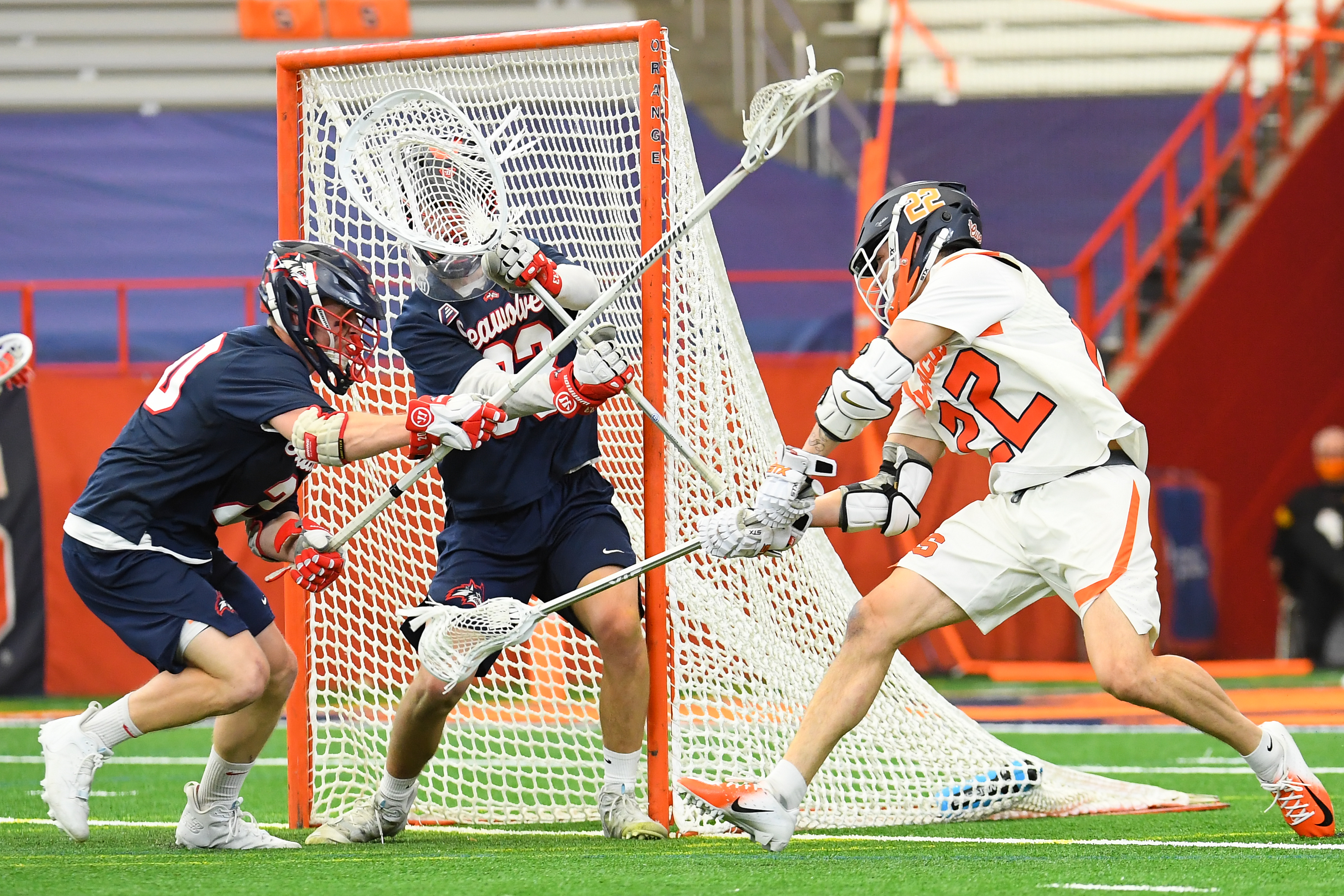 Mar 12, 2021; Syracuse, New York, USA; Syracuse Orange attackman Chase Scanlan (22) takes a back-hand shot on Stony Brook Seawolves goalie Anthony Palma (33) during the first half at the Carrier Dome. Mandatory Credit: Rich Barnes