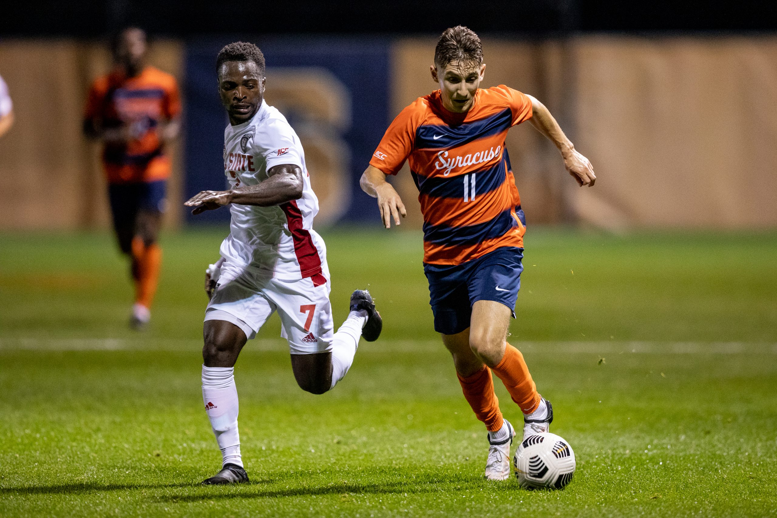 Syracuse Men's Soccer midfielder Hilli Goldhar drives past a NC State player in the 0-0 draw on Friday night.